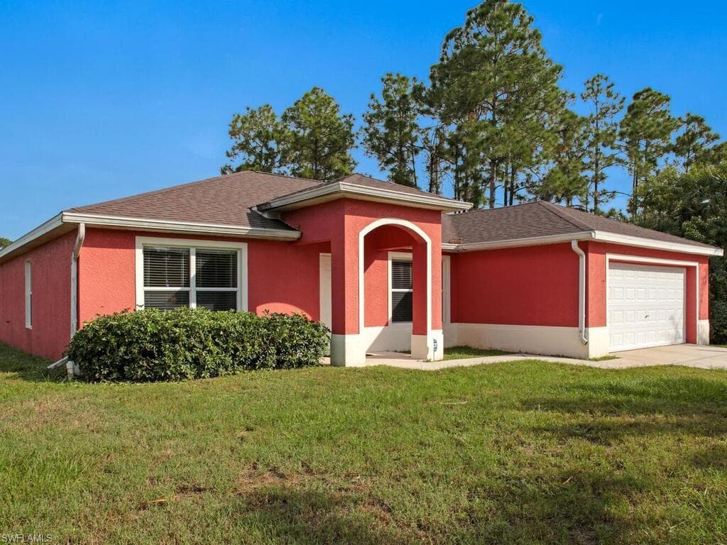 647 Sunflower AVE S LEHIGH ACRES, FL 33974