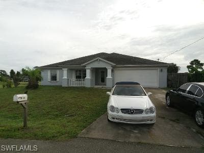 702 Yvonne AVE N LEHIGH ACRES, FL 33971