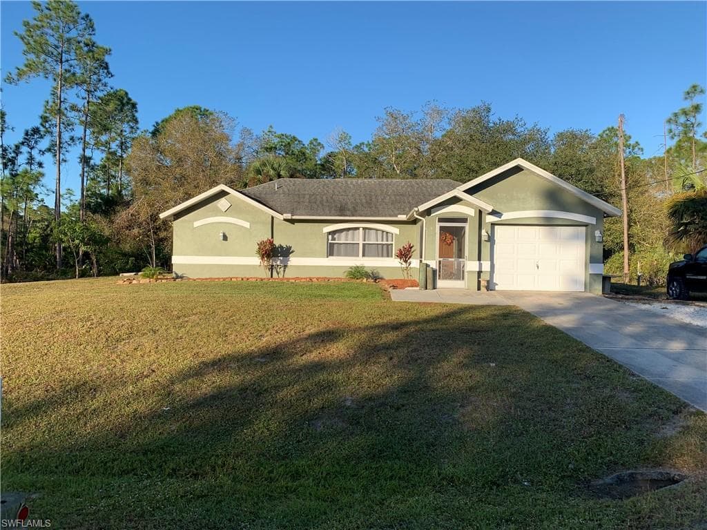 703 Moore AVE LEHIGH ACRES, FL 33972