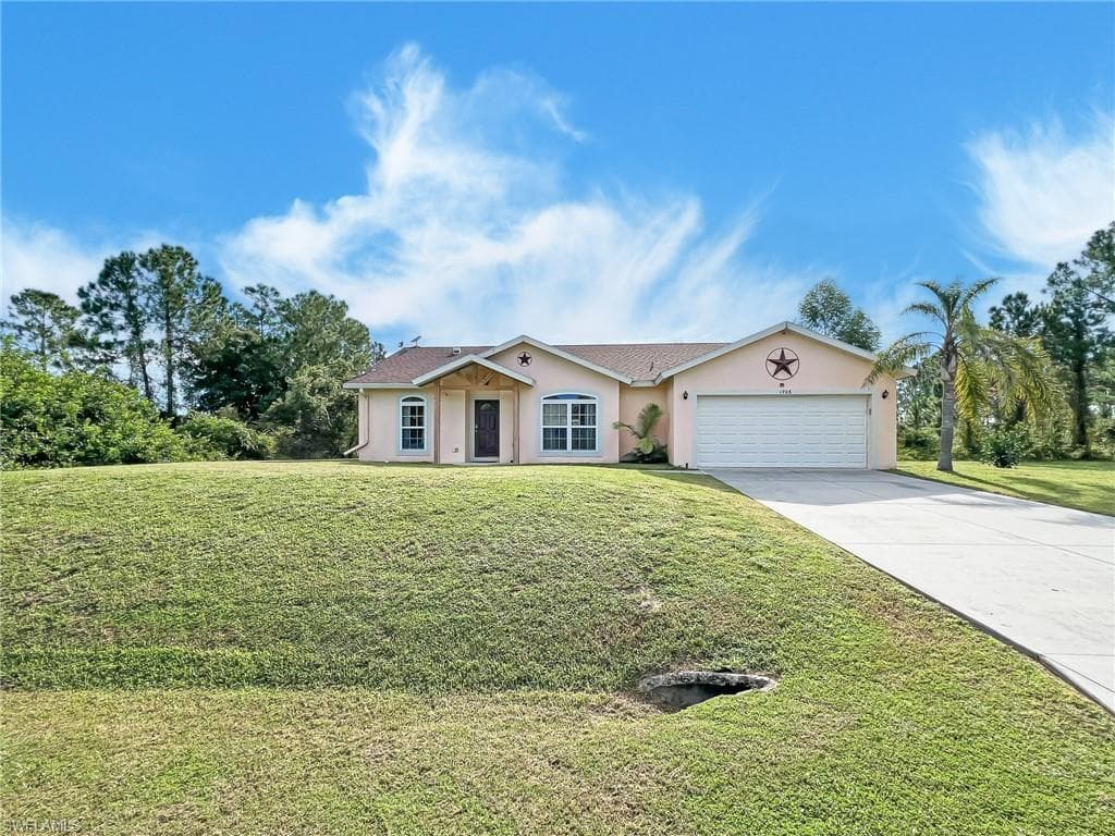 1908 WELLS AVE LEHIGH ACRES, FL 33972