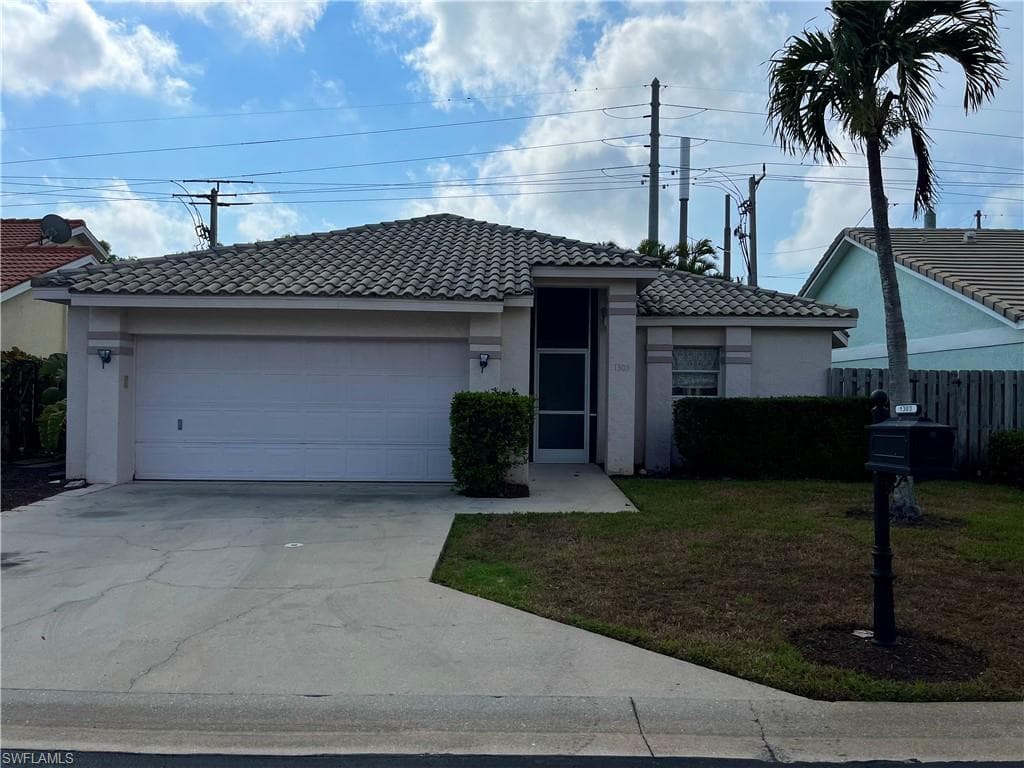 1303 NAPLES LAKE DR NAPLES, FL 34104