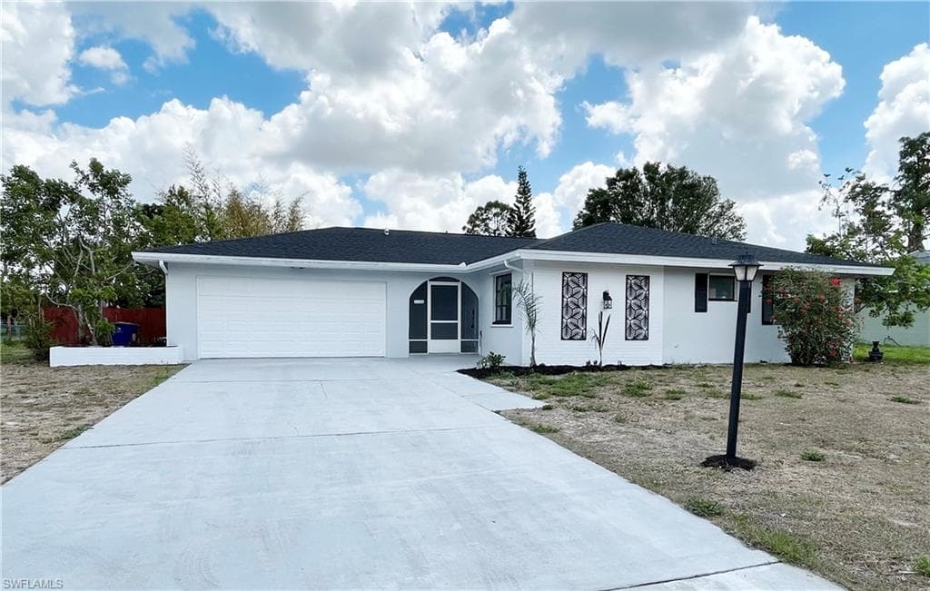214 Maple AVE N LEHIGH ACRES, FL 33936