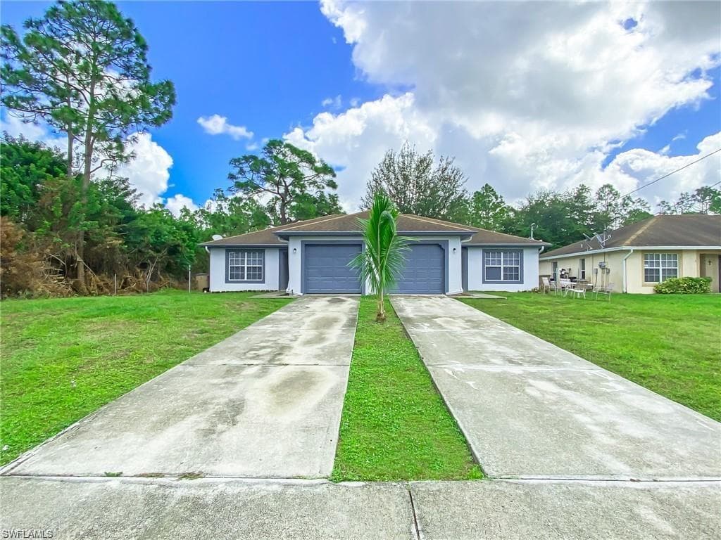 609 Hawthorne AVE S LEHIGH ACRES, FL 33974
