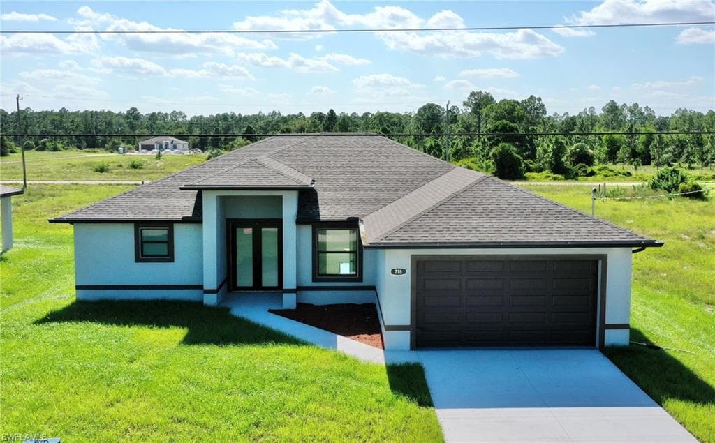 718 Downer AVE S LEHIGH ACRES, FL 33974