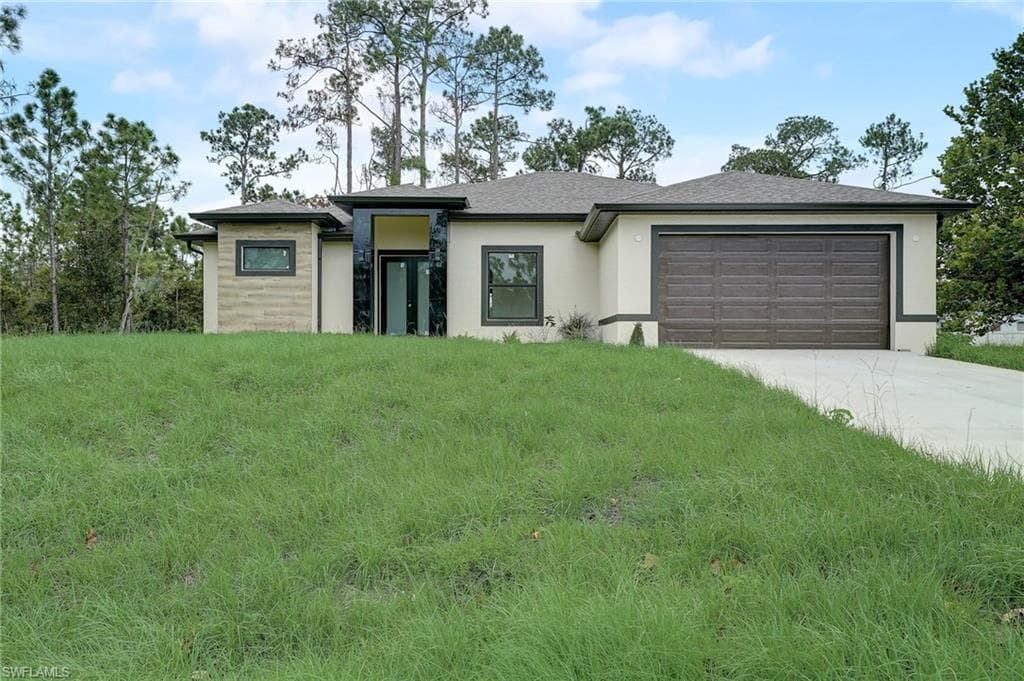 702 Maple AVE N LEHIGH ACRES, FL 33972