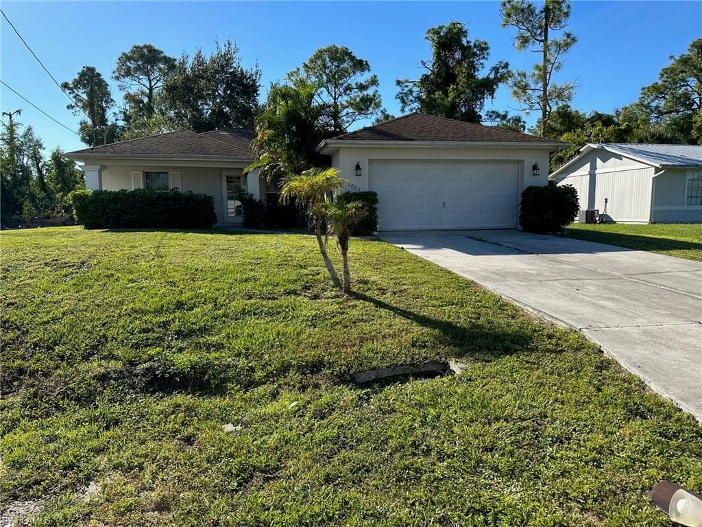 1203 Flora AVE N LEHIGH ACRES, FL 33971