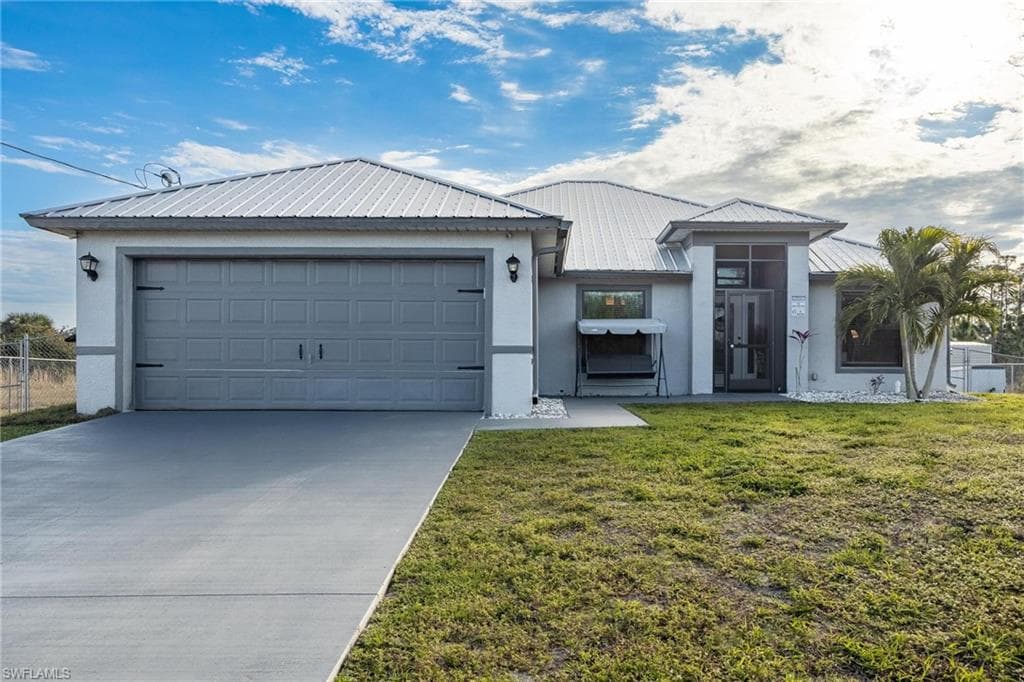 717 Fleming AVE S LEHIGH ACRES, FL 33974