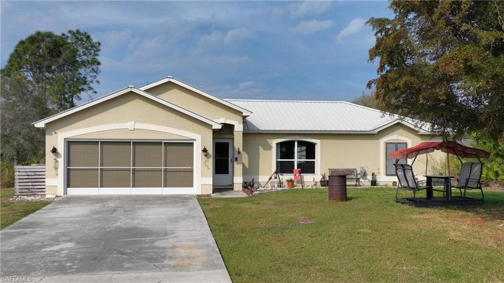 919 Maple AVE N LEHIGH ACRES, FL 33972
