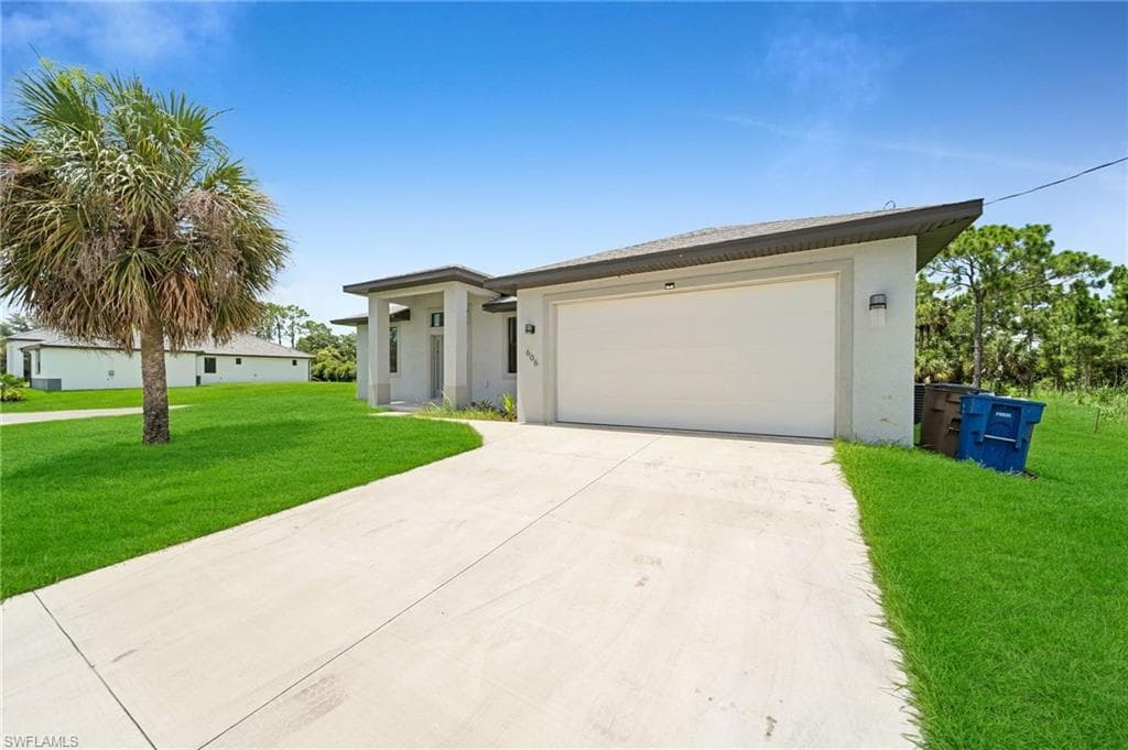 606 Lincoln BLVD LEHIGH ACRES, FL 33936