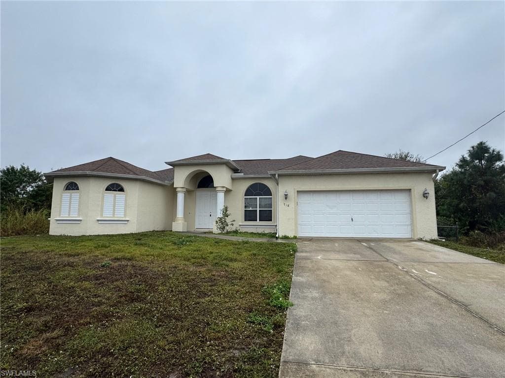 718 Jaguar BLVD LEHIGH ACRES, FL 33974