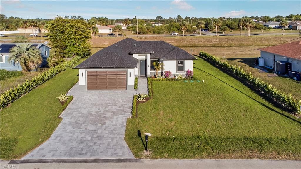 912 RITA AVE N LEHIGH ACRES, FL 33971