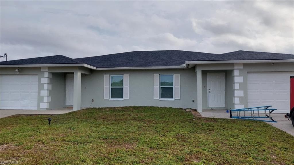 1405/1407 Hightower AVE S LEHIGH ACRES, FL 33973