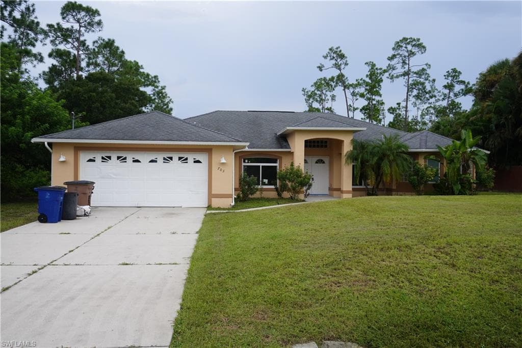 703 Grant AVE LEHIGH ACRES, FL 33972