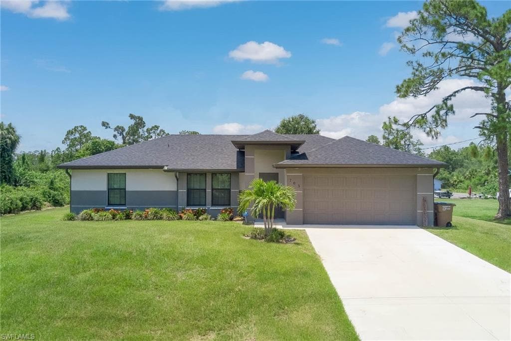 703 Wellington AVE LEHIGH ACRES, FL 33972