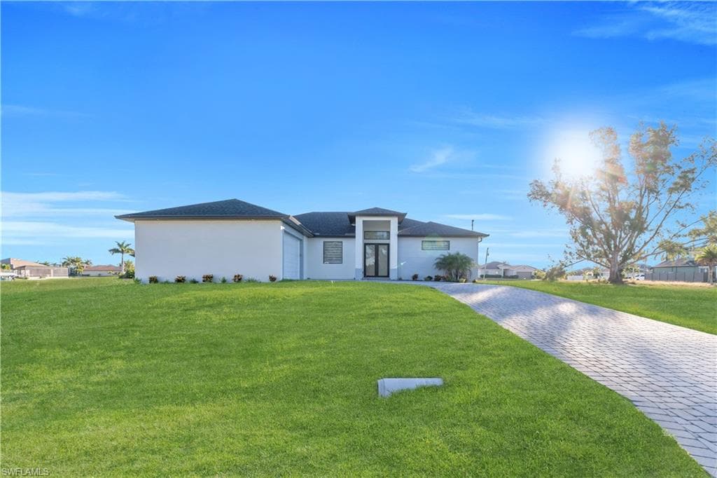 911 NW 37th PL CAPE CORAL, FL 33993