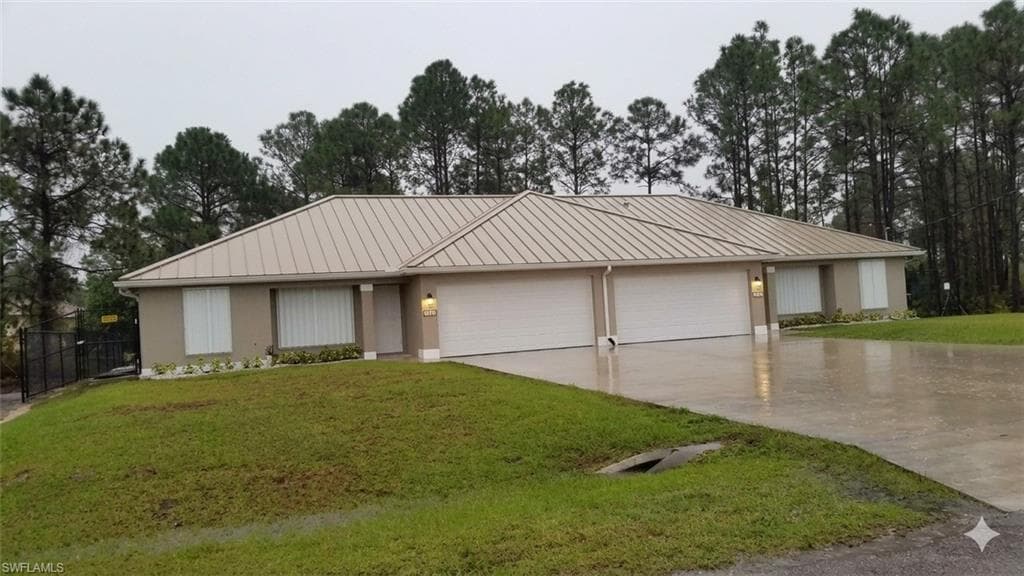 385/387 Carrillon AVE S LEHIGH ACRES, FL 33974