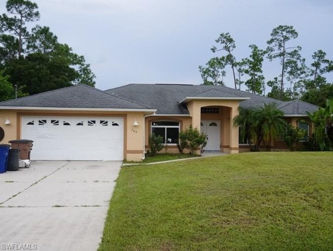 703 Grant AVE LEHIGH ACRES, FL 33972