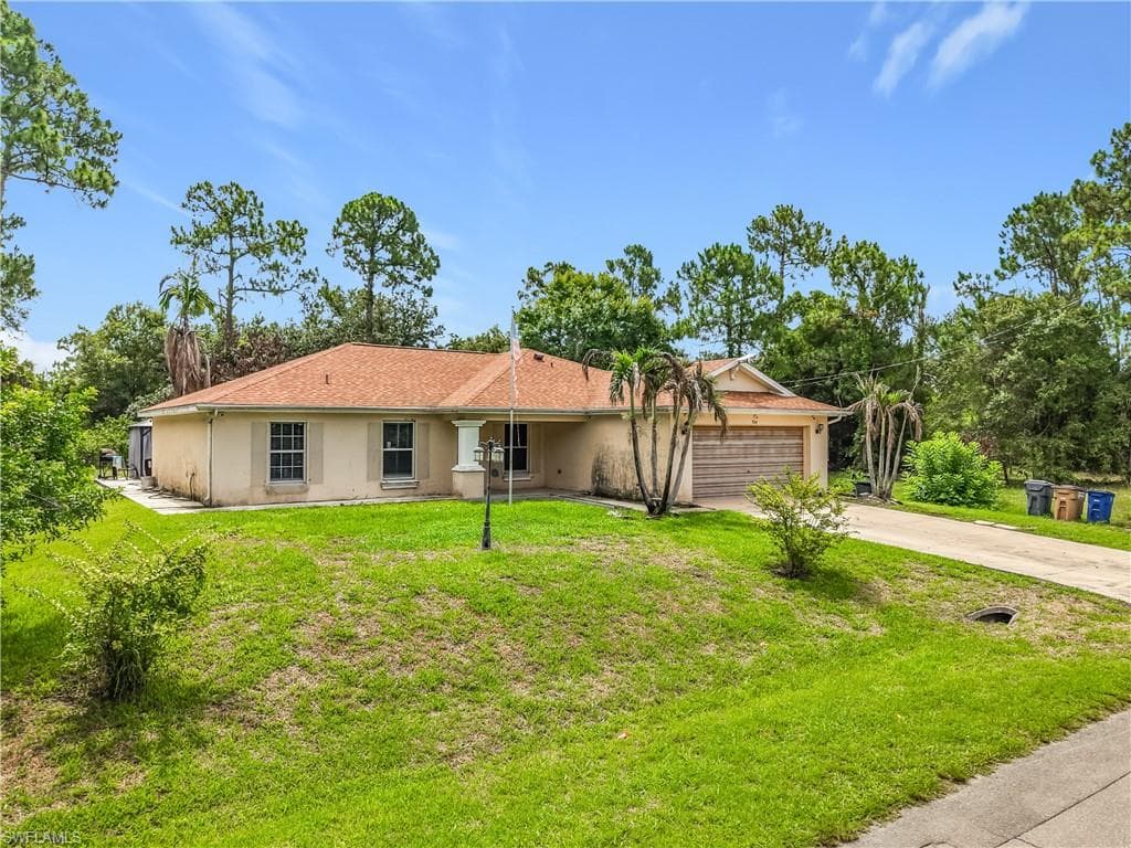 704 Moore AVE LEHIGH ACRES, FL 33972